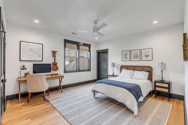 bedroom featuring light wood-style floors, baseboards, and recessed lighting