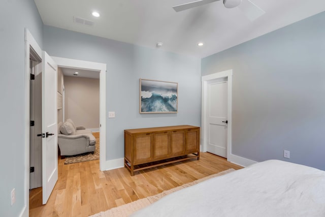 bedroom featuring light wood-style floors, baseboards, visible vents, and recessed lighting