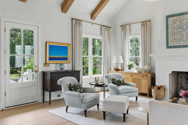 926 Pitt St, Mount Pleasant, SC 29464 - sitting room featuring beam ceiling, wood finished floors, a fireplace, and high vaulted ceiling
