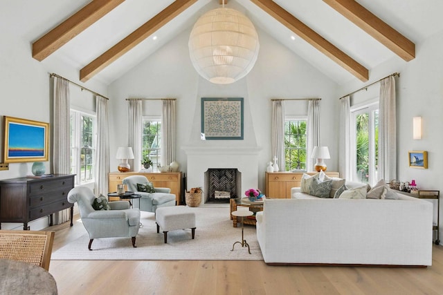 926 Pitt St, Mount Pleasant, SC 29464 - living room with high vaulted ceiling, beam ceiling, healthy amount of natural light, wood finished floors, and a fireplace