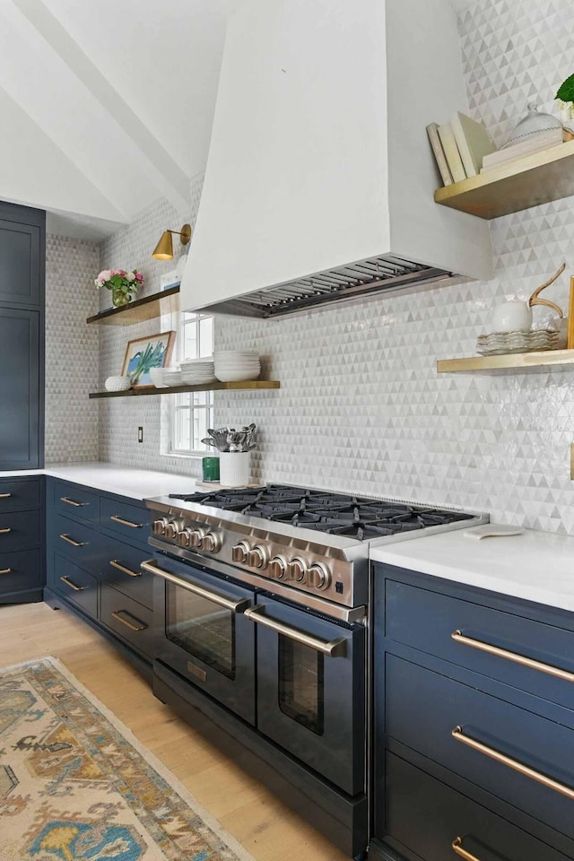 926 Pitt St, Mount Pleasant, SC 29464 - kitchen featuring open shelves, range with two ovens, premium range hood, blue cabinets, and vaulted ceiling