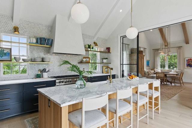 926 Pitt St, Mount Pleasant, SC 29464 - kitchen featuring open shelves, stainless steel gas stove, beam ceiling, decorative backsplash, and light wood-type flooring