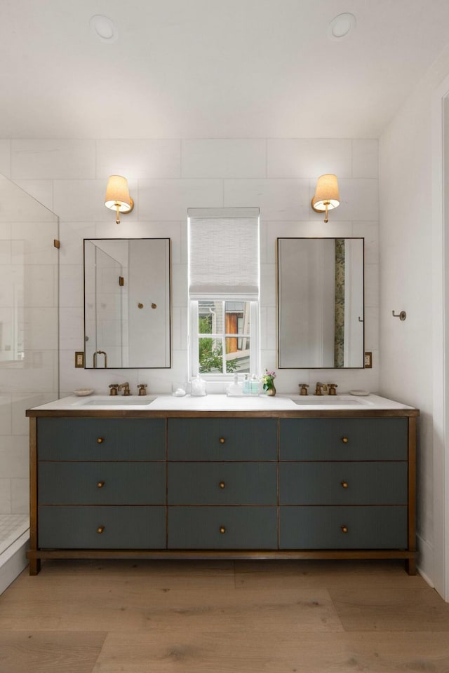926 Pitt St, Mount Pleasant, SC 29464 - full bath with double vanity, wood finished floors, and tiled shower