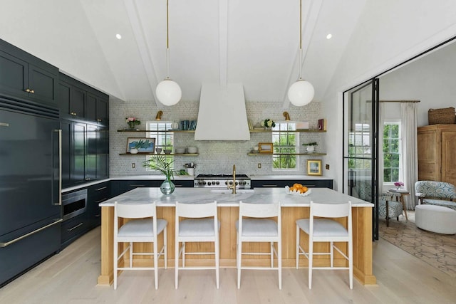 926 Pitt St, Mount Pleasant, SC 29464 - kitchen with paneled refrigerator, open shelves, gas range oven, custom exhaust hood, and high vaulted ceiling