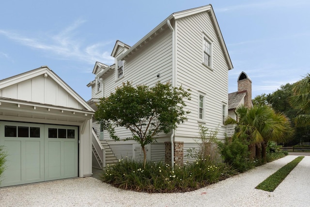 926 Pitt St, Mount Pleasant, SC 29464 - view of side of property featuring board and batten siding and a garage