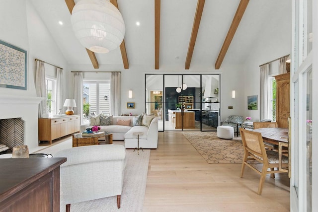 926 Pitt St, Mount Pleasant, SC 29464 - living room featuring light wood-type flooring, beamed ceiling, high vaulted ceiling, a fireplace, and recessed lighting