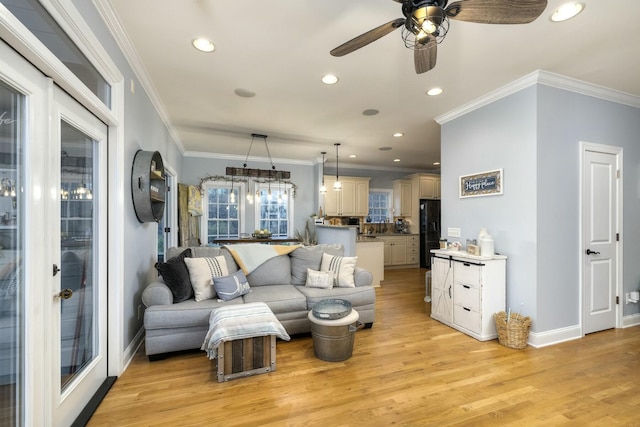 living area featuring recessed lighting, baseboards, light wood-style floors, and ornamental molding