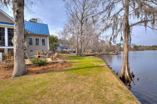 view of yard with a patio and a water view