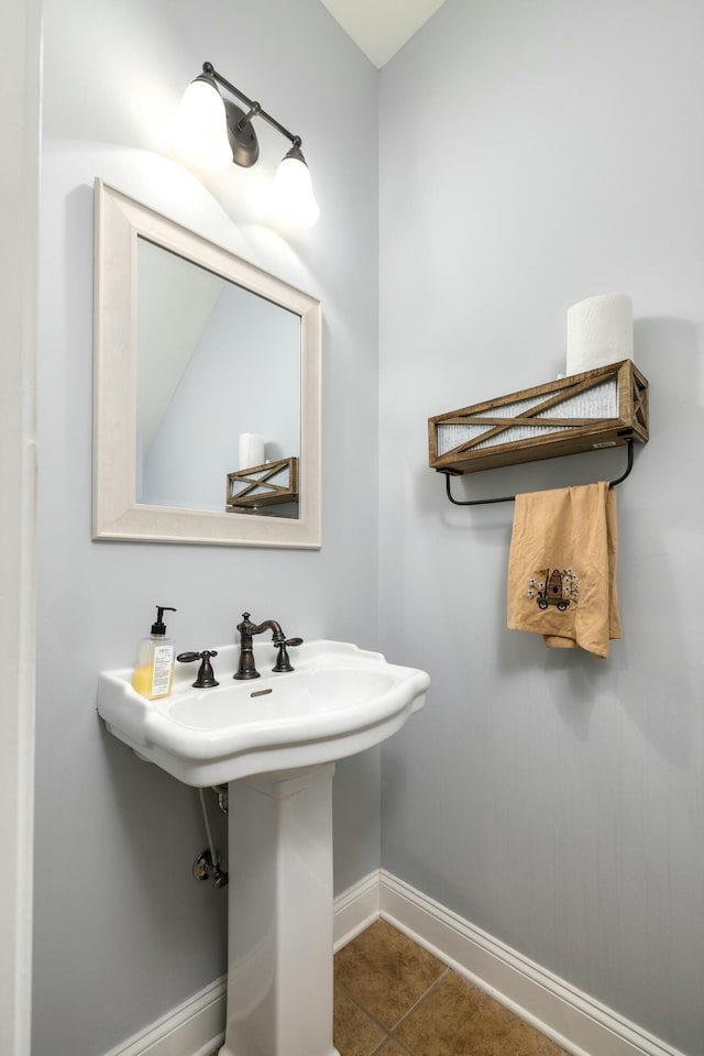 bathroom with tile patterned floors and baseboards