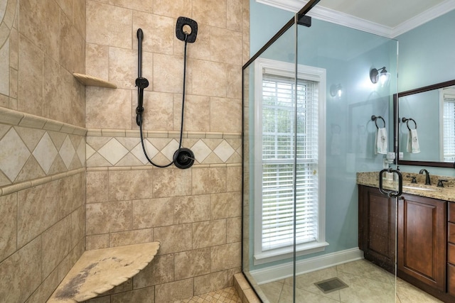 bathroom with visible vents, vanity, tiled shower, and crown molding