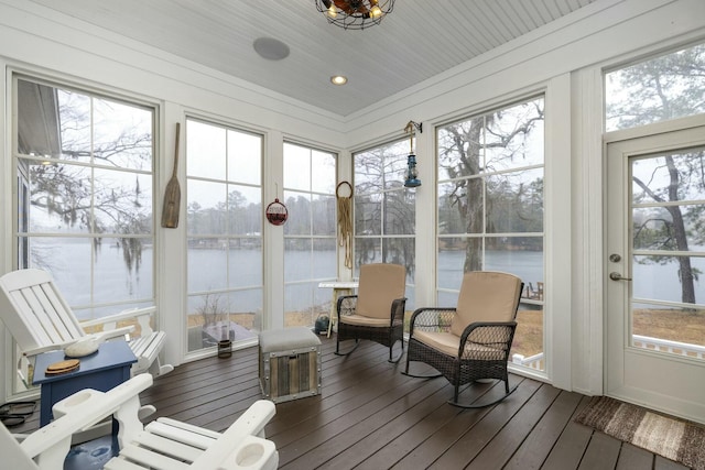 sunroom with a water view