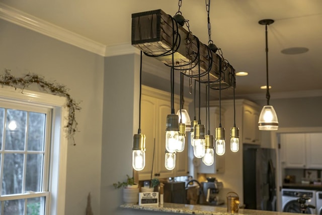 details featuring light stone counters, washer / clothes dryer, freestanding refrigerator, white cabinets, and crown molding