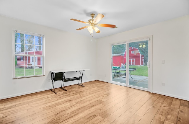 276 S Railroad Ave, Harleyville, SC 29448 - unfurnished room with wood finished floors, baseboards, and a ceiling fan