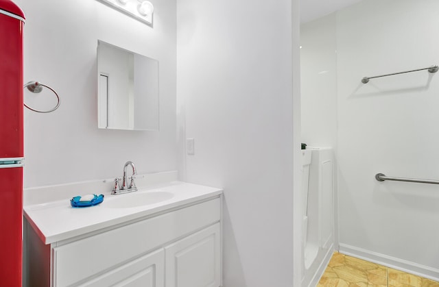 276 S Railroad Ave, Harleyville, SC 29448 - bathroom featuring baseboards and vanity