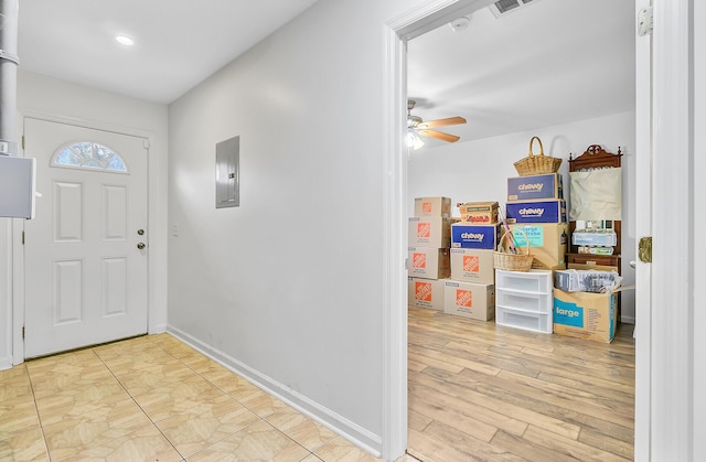 276 S Railroad Ave, Harleyville, SC 29448 - entrance foyer featuring wood finished floors, ceiling fan, baseboards, and electric panel