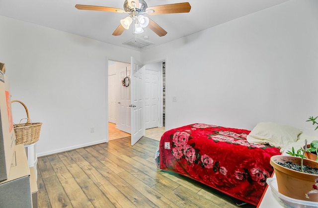 276 S Railroad Ave, Harleyville, SC 29448 - bedroom with ceiling fan, baseboards, and hardwood / wood-style flooring