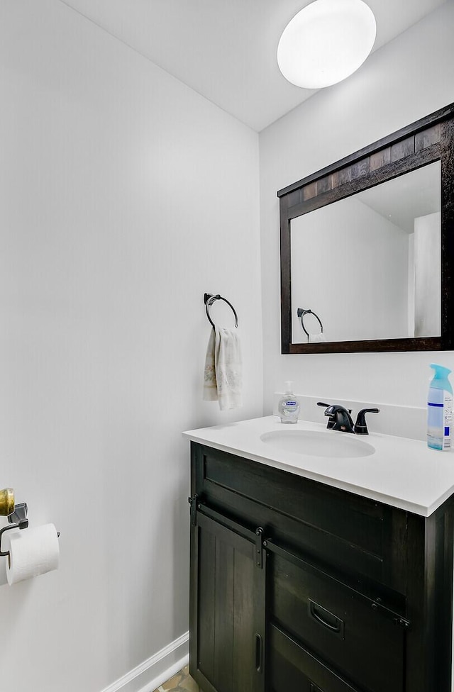 276 S Railroad Ave, Harleyville, SC 29448 - bathroom featuring baseboards and vanity