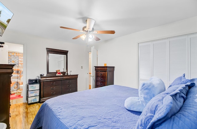 276 S Railroad Ave, Harleyville, SC 29448 - bedroom with light wood-style floors, a closet, and ceiling fan