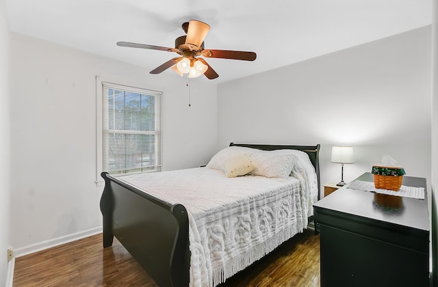 276 S Railroad Ave, Harleyville, SC 29448 - bedroom featuring ceiling fan, baseboards, and dark wood finished floors