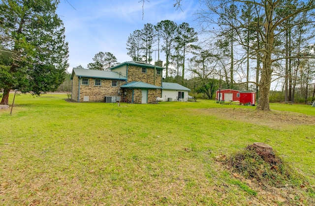 276 S Railroad Ave, Harleyville, SC 29448 - view of yard with central AC and an outbuilding