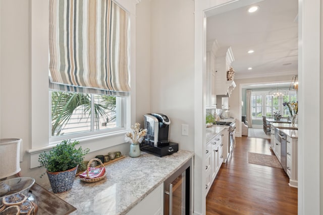 371 Bridgetown Pass, Mount Pleasant, SC 29464 - kitchen with beverage cooler, crown molding, white cabinets, light stone counters, and wood finished floors
