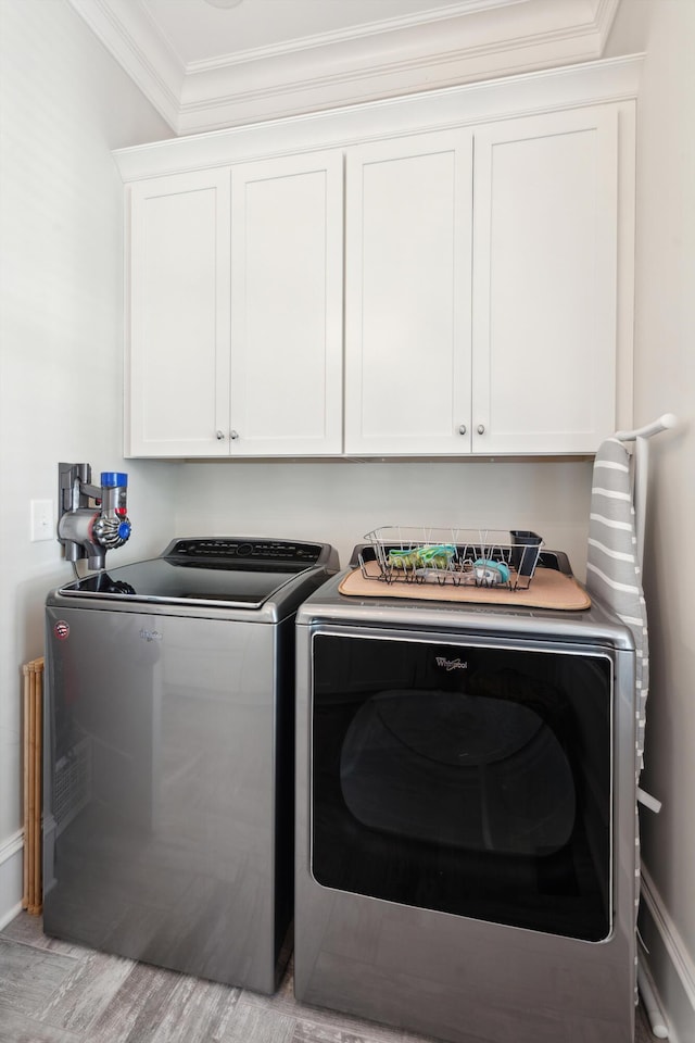 371 Bridgetown Pass, Mount Pleasant, SC 29464 - laundry room with washing machine and dryer, crown molding, cabinet space, and light wood-style floors