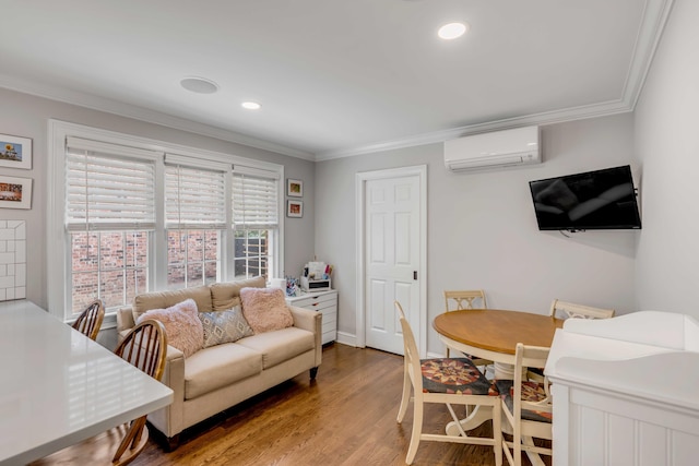 living room featuring recessed lighting, wood finished floors, crown molding, and a wall mounted AC