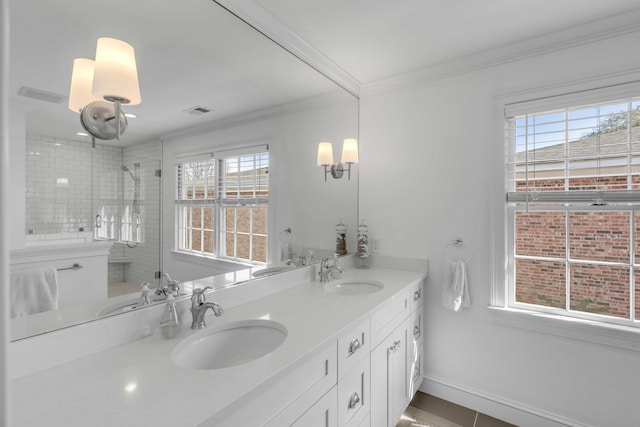 full bathroom with crown molding, a sink, and tiled shower