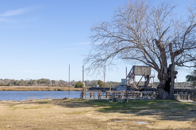 exterior space featuring a water view and a yard