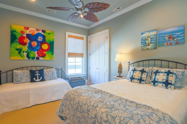 25 Ocean Point Dr, Isle Of Palms, SC 29451 - carpeted bedroom with crown molding, a closet, and ceiling fan