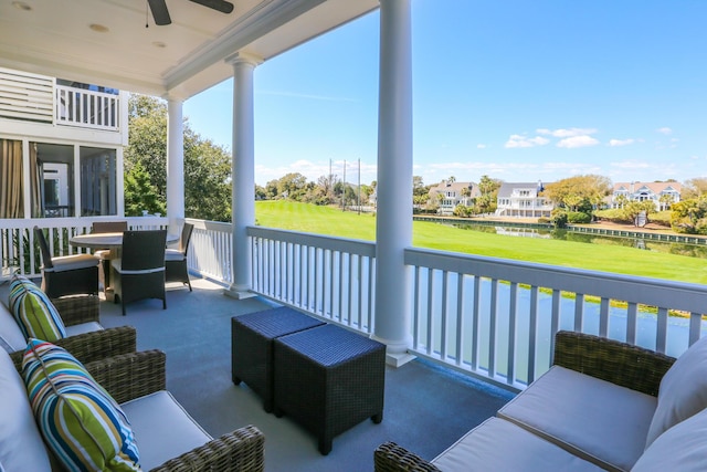 25 Ocean Point Dr, Isle Of Palms, SC 29451 - view of patio / terrace with ceiling fan, an outdoor living space, and a residential view