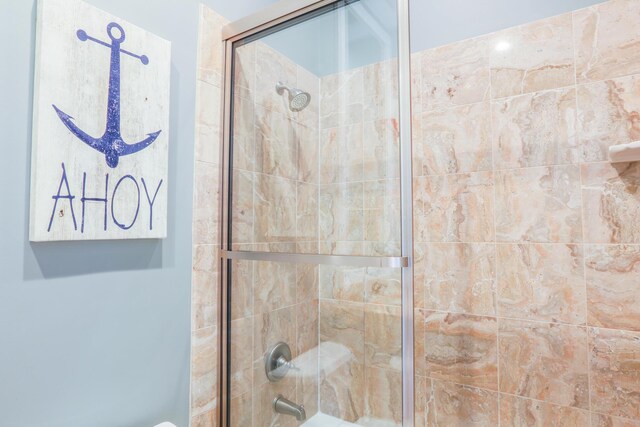 25 Ocean Point Dr, Isle Of Palms, SC 29451 - bathroom with combined bath / shower with glass door
