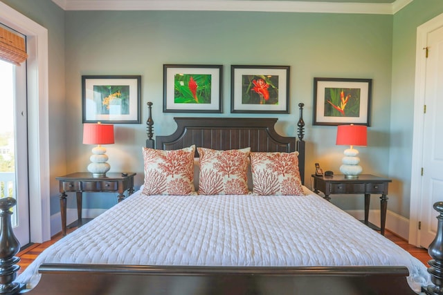 25 Ocean Point Dr, Isle Of Palms, SC 29451 - bedroom featuring ornamental molding, baseboards, and wood finished floors