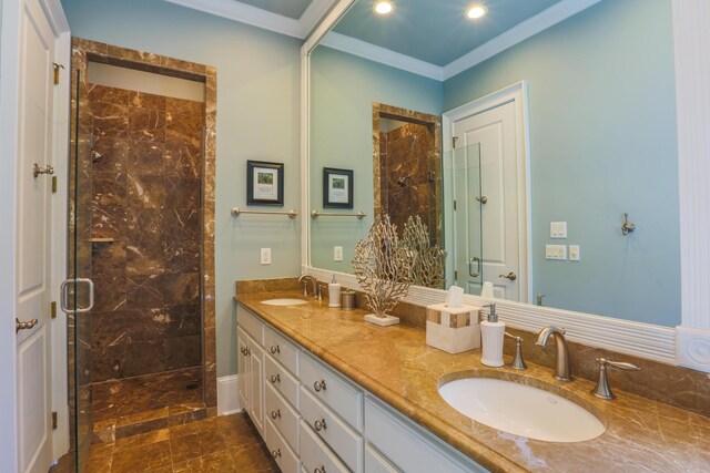 25 Ocean Point Dr, Isle Of Palms, SC 29451 - bathroom with a shower stall, ornamental molding, double vanity, and recessed lighting