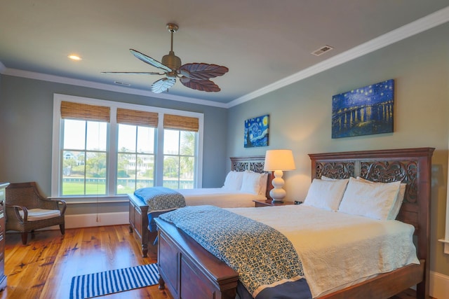 25 Ocean Point Dr, Isle Of Palms, SC 29451 - bedroom with crown molding, light wood-style flooring, baseboards, recessed lighting, and a ceiling fan