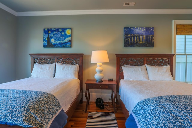 25 Ocean Point Dr, Isle Of Palms, SC 29451 - bedroom featuring wood finished floors, crown molding, and baseboards