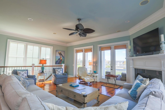 25 Ocean Point Dr, Isle Of Palms, SC 29451 - living room with a ceiling fan, crown molding, wood finished floors, and a fireplace