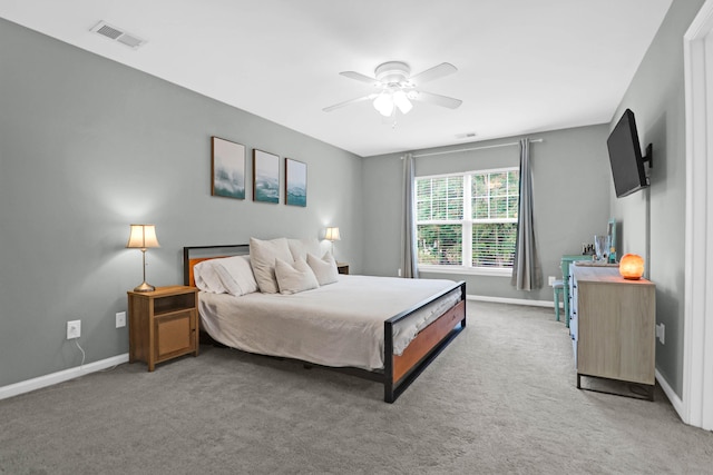 bedroom featuring dark carpet and ceiling fan