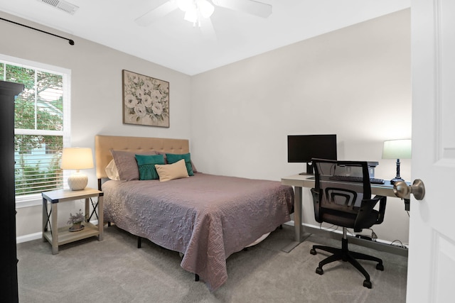 bedroom with ceiling fan and carpet floors