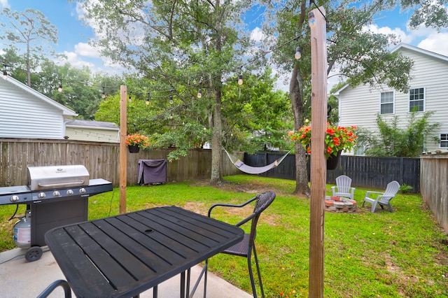 view of yard with a fire pit