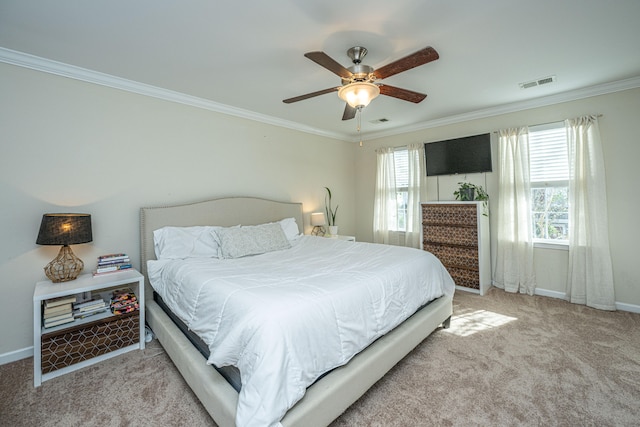 carpeted bedroom featuring ceiling fan and ornamental molding