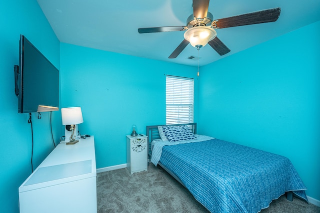 bedroom with ceiling fan and light carpet