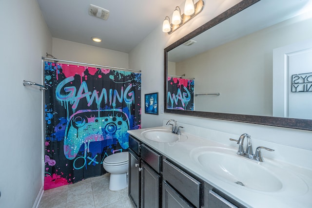 bathroom featuring tile patterned flooring, vanity, toilet, and walk in shower