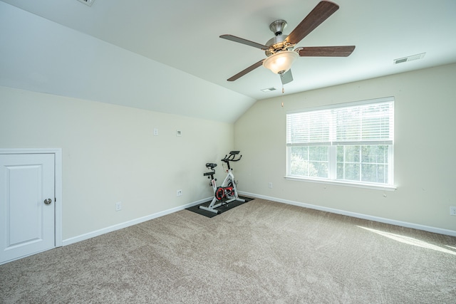 workout room with carpet floors, ceiling fan, and lofted ceiling