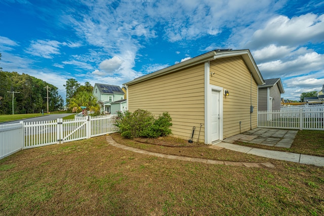 view of outbuilding with a yard