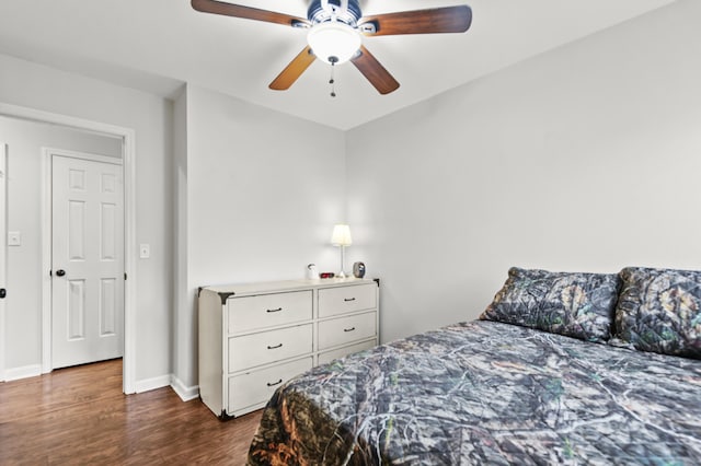 bedroom with dark wood finished floors, baseboards, and ceiling fan