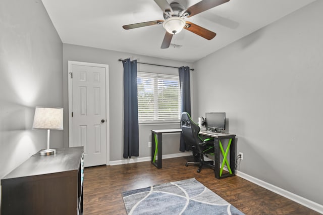 office space featuring a ceiling fan, baseboards, and dark wood-style floors