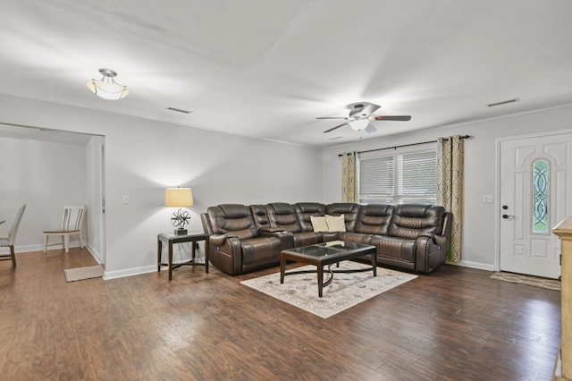 living room with a ceiling fan, wood finished floors, and baseboards