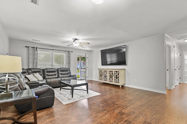living area with ceiling fan, wood finished floors, baseboards, and crown molding