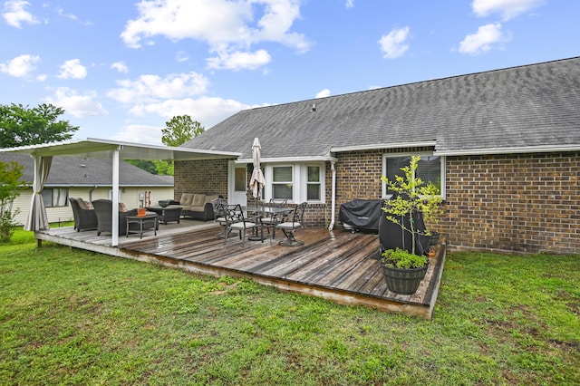 rear view of house with an outdoor living space, brick siding, a lawn, and roof with shingles